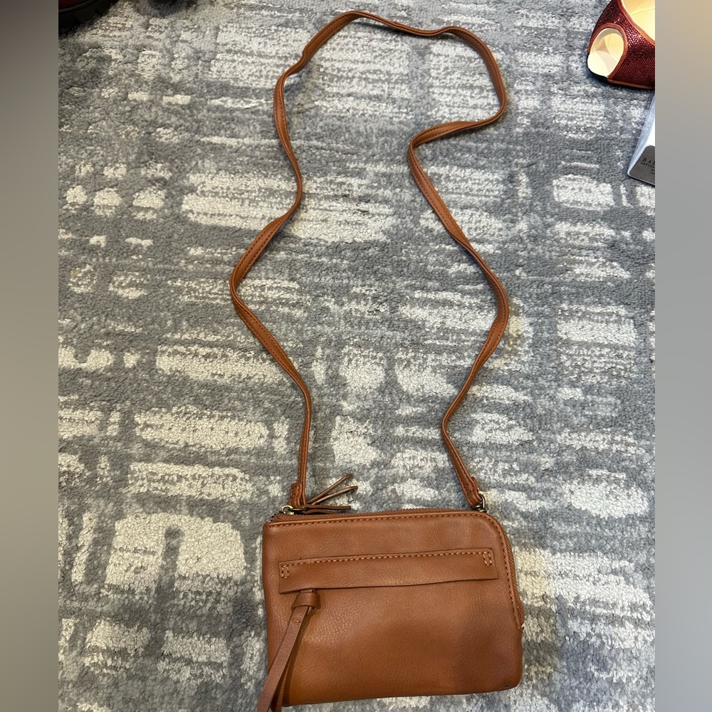 Small Crossbody which is light and has 2 sections for items Excellent condition
